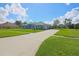 Charming single-story home with well-maintained lawn and expansive driveway at 5131 Appomattox Dr, North Port, FL 34287