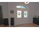 Bright foyer featuring glass double doors, a stylish light, and tile flooring at 5131 Appomattox Dr, North Port, FL 34287