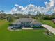 Charming single-story home featuring a well-manicured lawn, beautiful landscaping, and a concrete driveway at 5131 Appomattox Dr, North Port, FL 34287