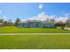 Charming single-story home featuring a beautifully landscaped front yard and a classic tile roof at 5131 Appomattox Dr, North Port, FL 34287