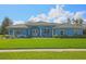A beautiful single story home with a well-manicured lawn, double door entry, and arched windows at 5131 Appomattox Dr, North Port, FL 34287