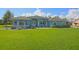 Beautiful single-story home with a large manicured lawn and well-maintained landscaping at 5131 Appomattox Dr, North Port, FL 34287