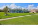 Inviting single-story home with manicured lawn, well-placed shrubs and mulch beds at 5131 Appomattox Dr, North Port, FL 34287