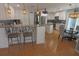 Open kitchen layout with white cabinets, stainless steel appliances, and a cozy dining nook at 5131 Appomattox Dr, North Port, FL 34287