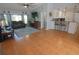 Cozy living room featuring a ceiling fan, a flat-screen TV, and comfortable seating at 5131 Appomattox Dr, North Port, FL 34287