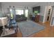 Spacious living room featuring tile flooring, a fireplace, and a large window offering ample natural light at 5131 Appomattox Dr, North Port, FL 34287