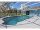 Beautiful pool with a screened enclosure and manicured landscaping at 5131 Appomattox Dr, North Port, FL 34287