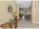 Welcoming entryway boasts tile flooring, an elegant vase with fresh flowers, and an inviting view into the living area at 8230 Agate St, Port Charlotte, FL 33981