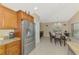 Kitchen and dining area showcasing the stainless steel refrigerator, cabinets and tile flooring at 8230 Agate St, Port Charlotte, FL 33981