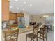 Bright eat-in kitchen features granite counters, stainless steel appliances, and a casual dining area with lots of light at 8230 Agate St, Port Charlotte, FL 33981