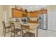 Contemporary kitchen featuring a granite island with seating, modern appliances and ample storage at 8230 Agate St, Port Charlotte, FL 33981