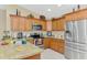 Stylish kitchen featuring stainless steel appliances, ample cabinetry, and granite countertops at 8230 Agate St, Port Charlotte, FL 33981