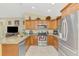 Well-equipped kitchen with stainless steel appliances, wood cabinets and an open layout at 8230 Agate St, Port Charlotte, FL 33981