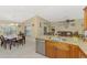 Spacious kitchen and dining area featuring tile flooring, and stainless steel appliances at 8230 Agate St, Port Charlotte, FL 33981