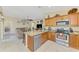Open concept kitchen offering stainless steel appliances and views into the comfortable living area at 8230 Agate St, Port Charlotte, FL 33981