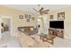 Comfortable living room with tile flooring, neutral walls and a large flat screen television at 8230 Agate St, Port Charlotte, FL 33981