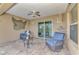 Cozy covered patio with comfortable seating and charming nautical decor at 8230 Agate St, Port Charlotte, FL 33981