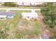 Aerial view of the property, showcasing the home's layout, landscaping, and neighborhood surroundings at 11369 1St Ave, Punta Gorda, FL 33955
