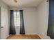 Simple bedroom with a window and neutral walls, featuring wood flooring for a cozy atmosphere at 11369 1St Ave, Punta Gorda, FL 33955