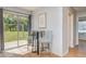 Bright dining area with sliding glass doors to the backyard and stylish seating at 11369 1St Ave, Punta Gorda, FL 33955