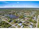 Aerial view of the neighborhood surrounding a lake at 1391 Abalom St, Punta Gorda, FL 33980