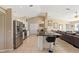Bright kitchen with stainless steel appliances, dark countertops, and a breakfast bar with seating at 1391 Abalom St, Punta Gorda, FL 33980