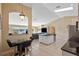 Modern kitchen features an island, stainless appliances, and an adjacent dining area with waterfront views at 1391 Abalom St, Punta Gorda, FL 33980