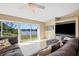 Cozy living room features a large waterfront window and a built in entertainment center at 1391 Abalom St, Punta Gorda, FL 33980