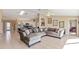 Large living room offers comfortable seating and an open floor plan to the kitchen at 1391 Abalom St, Punta Gorda, FL 33980