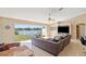 Spacious living room with large windows overlooking the backyard and waterfront at 1391 Abalom St, Punta Gorda, FL 33980