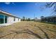 The home features a large, open backyard and an ideal space for outdoor activities at 149 Hercules Dr, Rotonda West, FL 33947