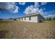 The home features a spacious backyard and an ideal outdoor living and recreational space at 149 Hercules Dr, Rotonda West, FL 33947