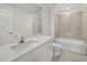 Bright bathroom featuring tiled floors, bathtub, shower, and a vanity with sink at 149 Hercules Dr, Rotonda West, FL 33947