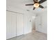 Bright bedroom featuring tile floors, a ceiling fan, and closet at 149 Hercules Dr, Rotonda West, FL 33947