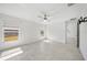 A light and airy bedroom with tile floors and a ceiling fan at 149 Hercules Dr, Rotonda West, FL 33947