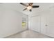Cozy bedroom featuring a ceiling fan, closet, and tile flooring at 149 Hercules Dr, Rotonda West, FL 33947