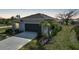 Lovely single-story home with a well-kept lawn, a convenient driveway, and a two-car garage at 149 Hercules Dr, Rotonda West, FL 33947