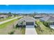 Well-maintained single-story home featuring a two-car garage and a beautifully landscaped front yard at 149 Hercules Dr, Rotonda West, FL 33947