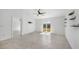 A spacious living room featuring modern tile floors and lots of natural light at 149 Hercules Dr, Rotonda West, FL 33947