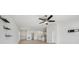 Open-concept living space with modern decor, seamlessly connecting the living, dining, and kitchen areas at 149 Hercules Dr, Rotonda West, FL 33947