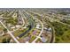 Aerial view of a home in a planned community with a backyard pool overlooking the river at 158 Mariner Ln, Rotonda West, FL 33947