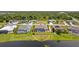 Aerial view of a home with a pool and backyard enclosed by black metal fencing at 158 Mariner Ln, Rotonda West, FL 33947