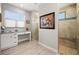 Bright bathroom with vanity area and tiled walk-in shower with bench at 158 Mariner Ln, Rotonda West, FL 33947