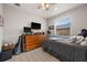 Cozy bedroom with ceiling fan, window view, and ample furniture at 158 Mariner Ln, Rotonda West, FL 33947