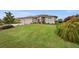 Charming single Gathering home featuring a manicured lawn and a three-car garage at 158 Mariner Ln, Rotonda West, FL 33947