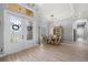 An inviting foyer with elegant double doors, chandelier, and light, airy tile flooring at 158 Mariner Ln, Rotonda West, FL 33947