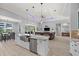 Open concept kitchen with island overlooks the living room and backyard at 158 Mariner Ln, Rotonda West, FL 33947