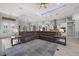 Open-concept living area with a view of the kitchen, chandelier, and tile flooring at 158 Mariner Ln, Rotonda West, FL 33947