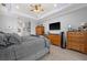 Bright bedroom with tray ceiling, ceiling fan, and natural light at 158 Mariner Ln, Rotonda West, FL 33947