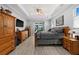 Spacious bedroom with tray ceiling, ceiling fan, and sliding glass door at 158 Mariner Ln, Rotonda West, FL 33947